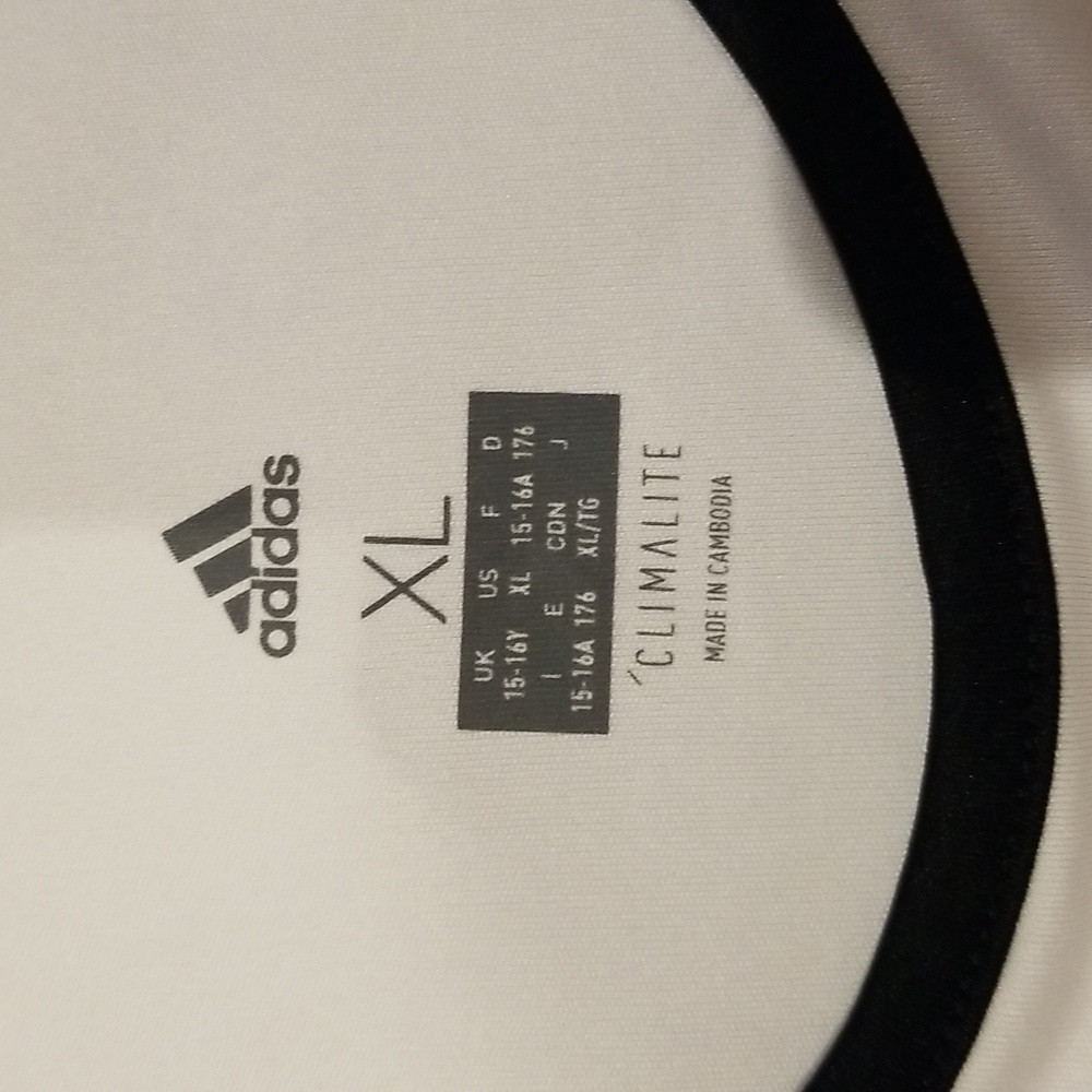 Adidas Tennis Shirt Size XL.         Color: White w/Black Trim